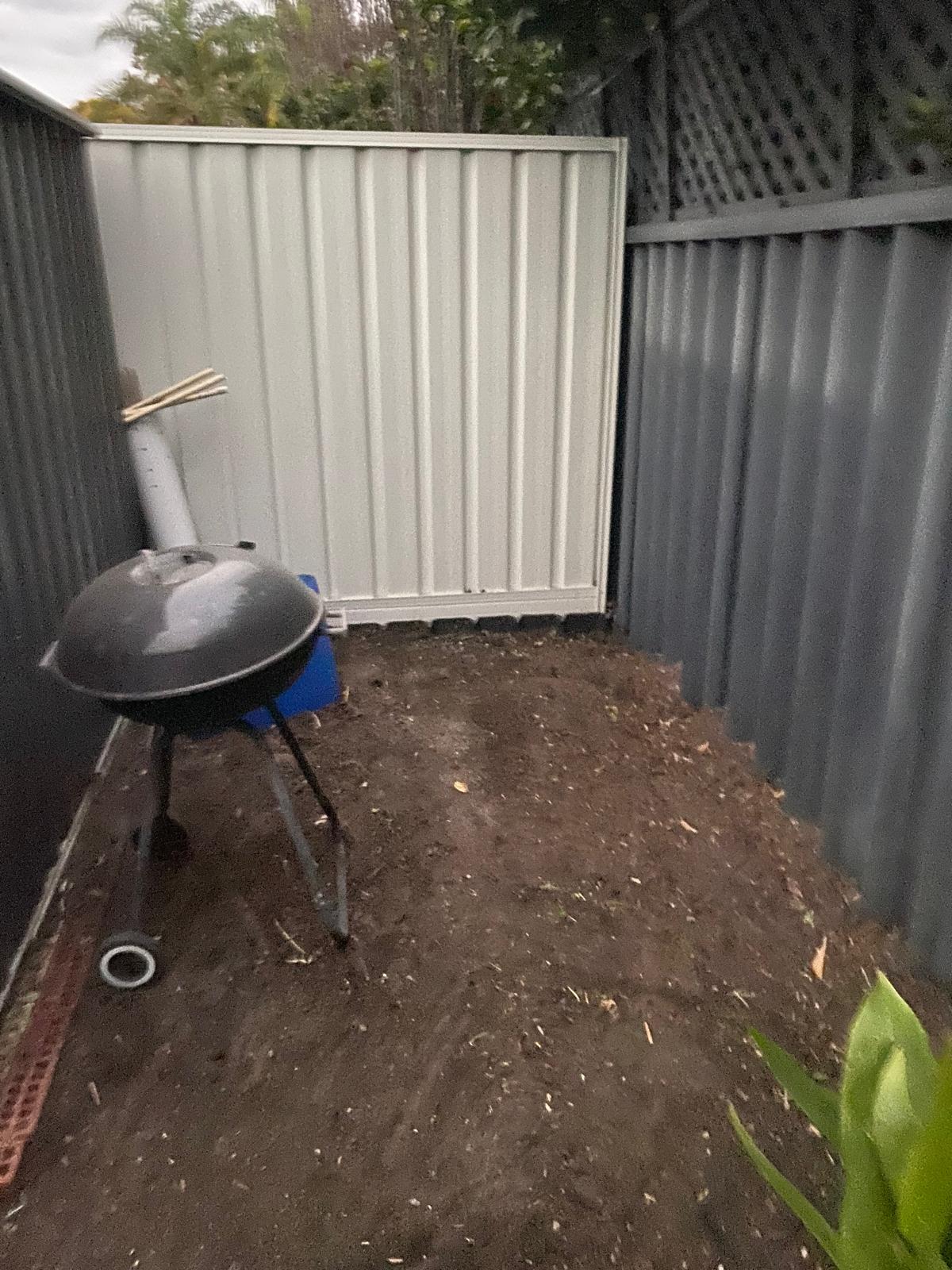 The same Perth side yard after a garden tidy-up, cleared back to bare soil and swept clean